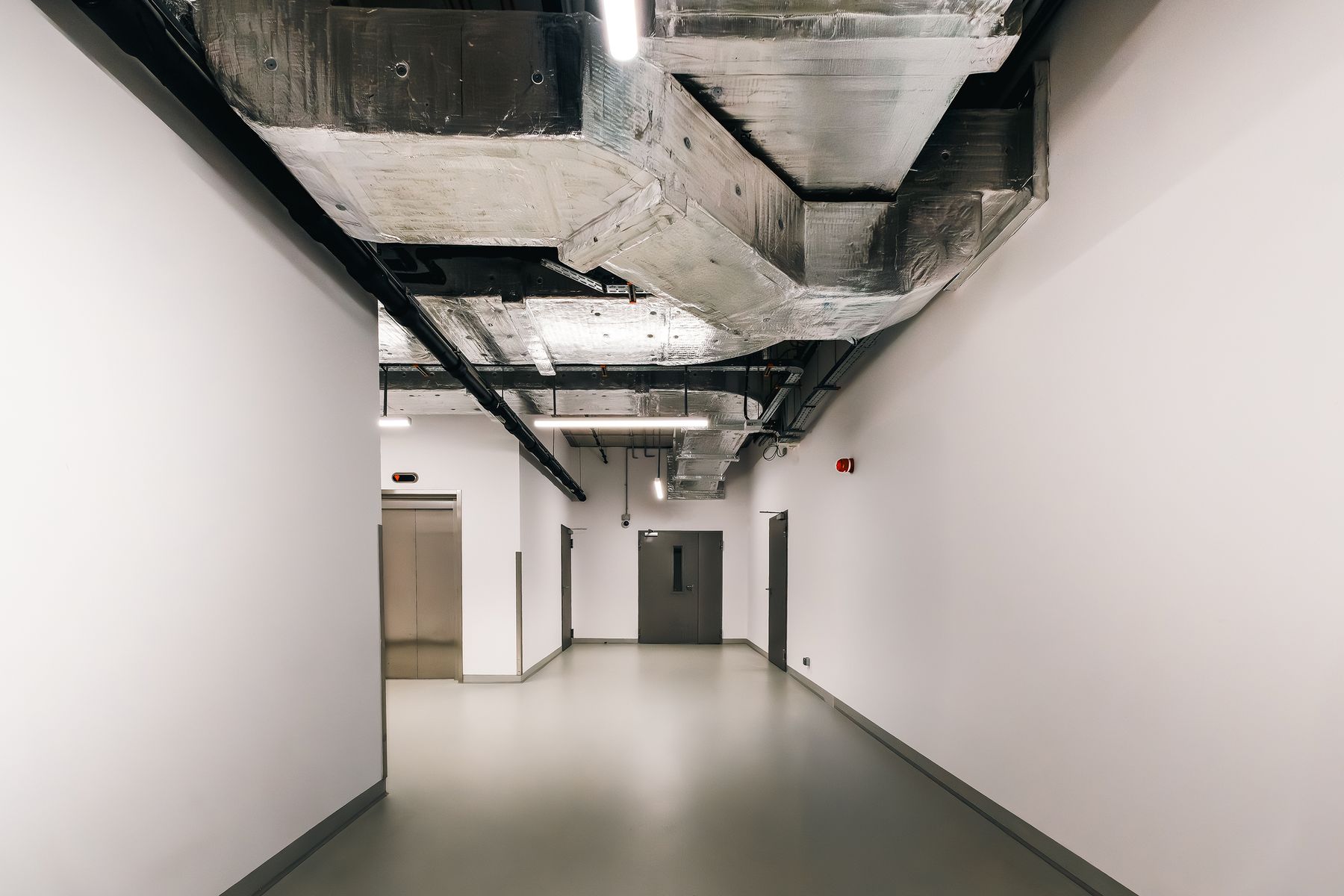 Exposed ductwork and services in a commercial building